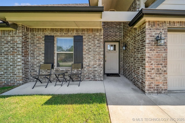 8035 Tims Ln, Claremore, OK 74019 - property entrance with brick siding and a garage