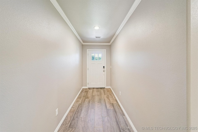 8035 Tims Ln, Claremore, OK 74019 - entryway featuring light wood finished floors and ornamental molding