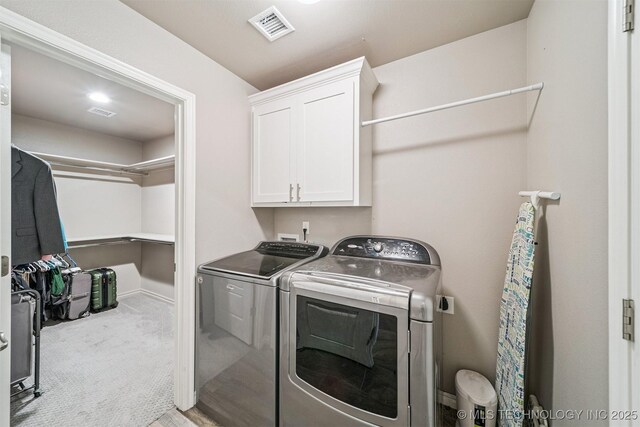 8035 Tims Ln, Claremore, OK 74019 - laundry area featuring cabinet space, washing machine and dryer, and carpet flooring