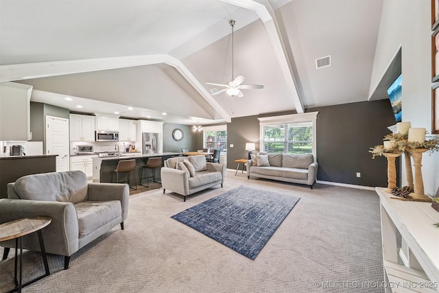 8035 Tims Ln, Claremore, OK 74019 - living room featuring ceiling fan, beam ceiling, light carpet, high vaulted ceiling, and recessed lighting