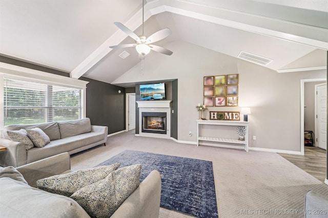 8035 Tims Ln, Claremore, OK 74019 - carpeted living area featuring ceiling fan and a warm lit fireplace