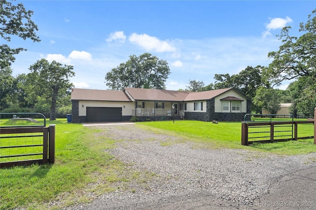 70155 S 336th Ct, Wagoner, OK 74467 - ranch-style home with an attached garage, gravel driveway, and stone siding
