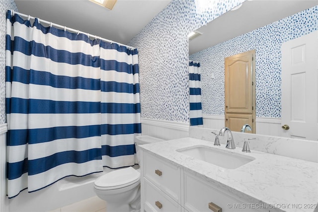 70155 S 336th Ct, Wagoner, OK 74467 - bathroom featuring wallpapered walls, wainscoting, and vanity