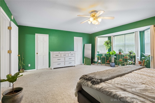 70155 S 336th Ct, Wagoner, OK 74467 - carpeted bedroom featuring multiple windows and a ceiling fan