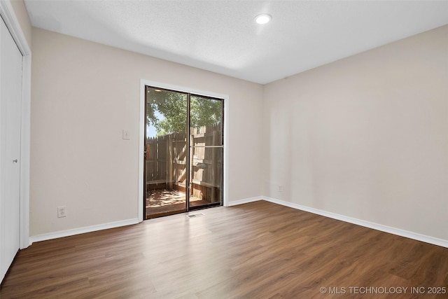 2807 E 90th St Unit 4, Tulsa, OK 74137 - empty room featuring wood finished floors and recessed lighting