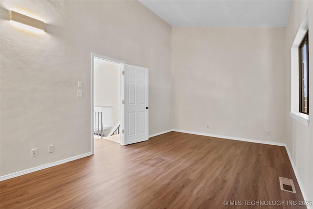 2807 E 90th St Unit 4, Tulsa, OK 74137 - empty room with wood finished floors and baseboards