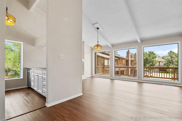 2807 E 90th St Unit 4, Tulsa, OK 74137 - unfurnished living room with dark wood-style floors and baseboards