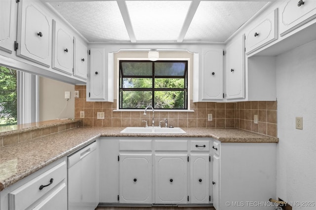 1121 S 221st W Ave, Sand Springs, OK 74063 - kitchen featuring dishwasher, white cabinetry, tasteful backsplash, and plenty of natural light