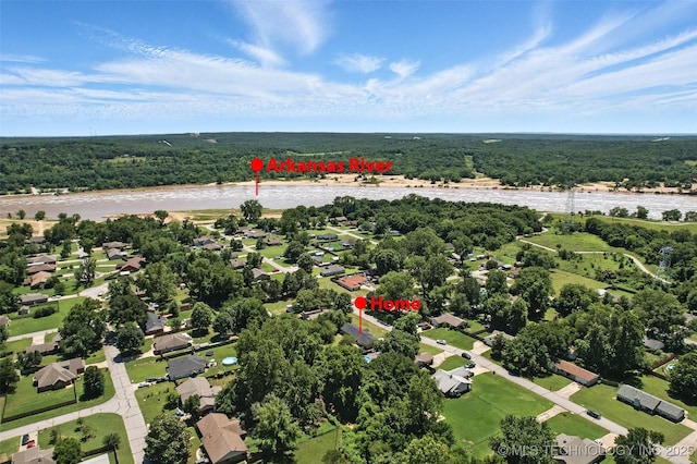 1121 S 221st W Ave, Sand Springs, OK 74063 - aerial overview of property's location with a forest and nearby suburban area
