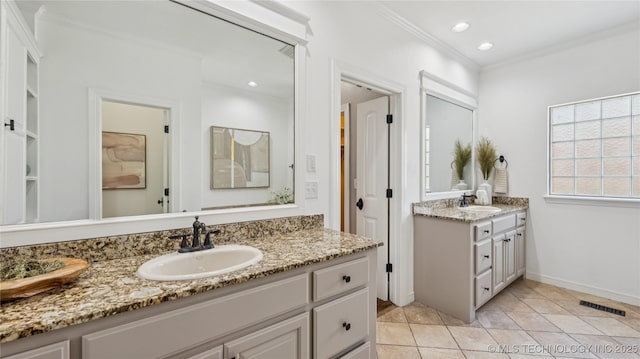 9198 E 120th St S, Bixby, OK 74008 - full bathroom featuring two vanities, crown molding, tile patterned flooring, and recessed lighting
