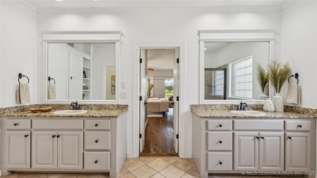 9198 E 120th St S, Bixby, OK 74008 - bathroom with crown molding, two vanities, tile patterned flooring, a shower with shower door, and ensuite bath