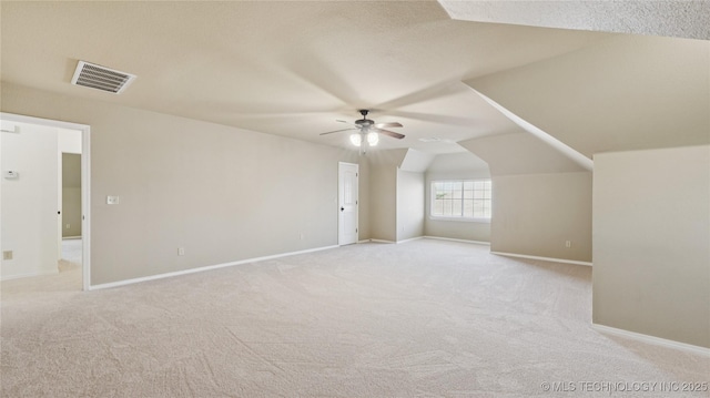 9198 E 120th St S, Bixby, OK 74008 - additional living space with ceiling fan, light carpet, and vaulted ceiling
