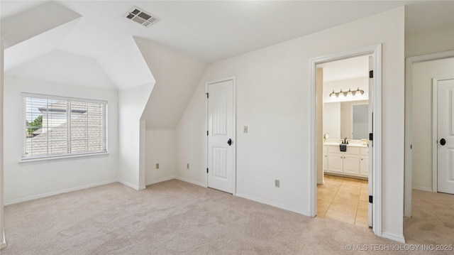 9198 E 120th St S, Bixby, OK 74008 - additional living space with light colored carpet and vaulted ceiling