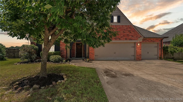 9198 E 120th St S, Bixby, OK 74008 - view of front of house featuring brick siding, driveway, and a garage