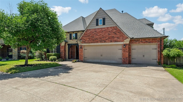 9198 E 120th St S, Bixby, OK 74008 - view of front of property with brick siding, driveway, a garage, a front yard, and a shingled roof