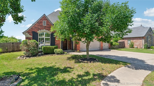 9198 E 120th St S, Bixby, OK 74008 - view of front of home with brick siding, concrete driveway, and roof with shingles