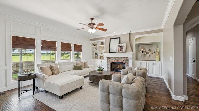 9198 E 120th St S, Bixby, OK 74008 - living room featuring ornamental molding, a ceiling fan, wood finished floors, built in features, and a fireplace