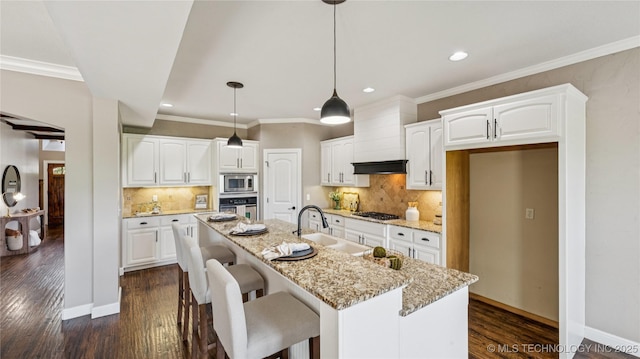 9198 E 120th St S, Bixby, OK 74008 - kitchen featuring stainless steel appliances, dark wood-style flooring, recessed lighting, white cabinets, and light stone countertops
