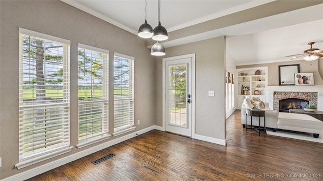9198 E 120th St S, Bixby, OK 74008 - unfurnished dining area featuring healthy amount of natural light, crown molding, wood finished floors, and built in shelves