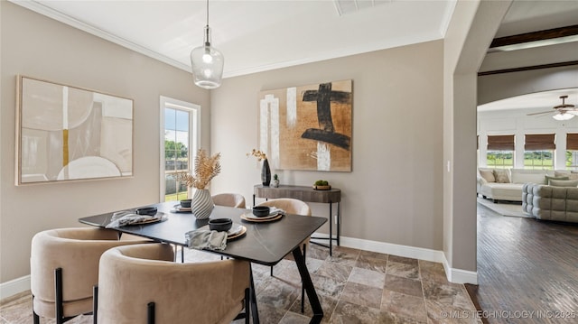 9198 E 120th St S, Bixby, OK 74008 - dining area with ornamental molding, arched walkways, and a ceiling fan