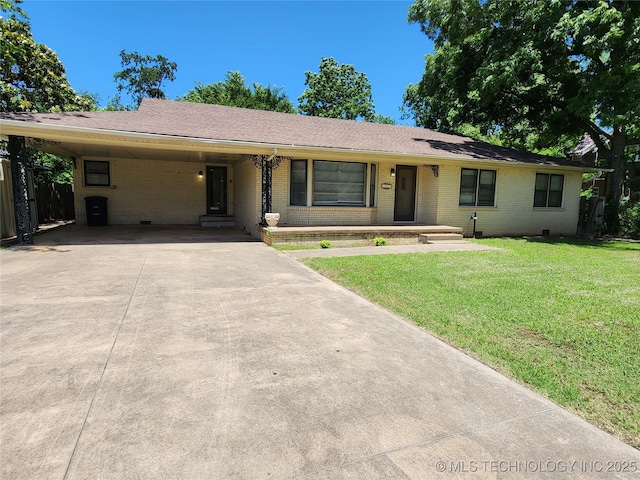 10 W Midland, Shawnee, OK 74804 - ranch-style home featuring brick siding, concrete driveway, an attached carport, and roof with shingles