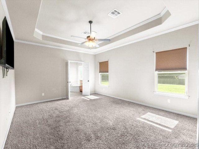 23609 E 135th St, Coweta, OK 74429 - unfurnished bedroom with a tray ceiling, crown molding, carpet flooring, and a ceiling fan