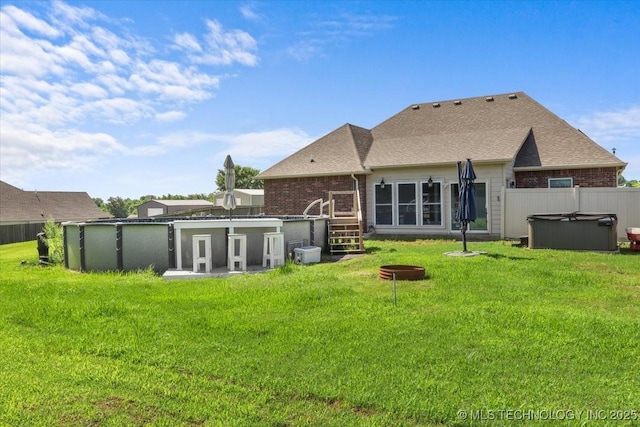 23609 E 135th St, Coweta, OK 74429 - back of property featuring a hot tub and brick siding