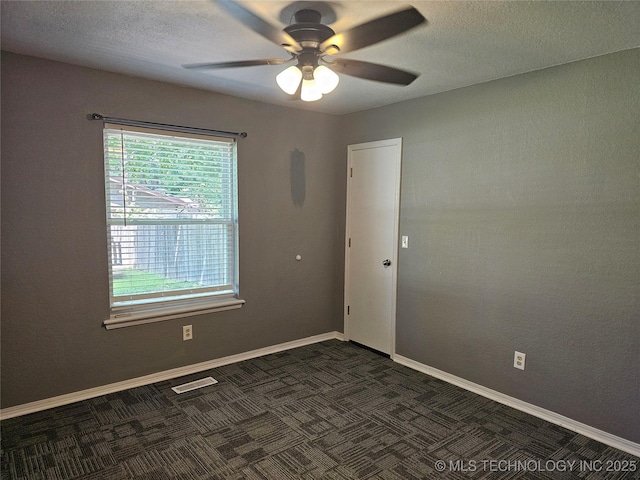 12717 E 133rd Pl S, Broken Arrow, OK 74011 - spare room featuring a ceiling fan, dark carpet, and a textured ceiling