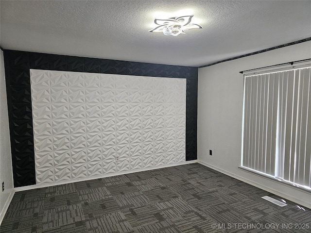 12717 E 133rd Pl S, Broken Arrow, OK 74011 - spare room with dark colored carpet and a textured ceiling