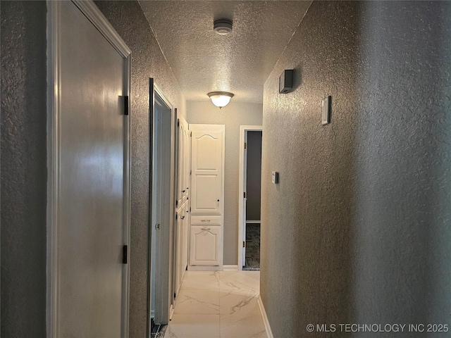 12717 E 133rd Pl S, Broken Arrow, OK 74011 - hall with light marble finish floors, a textured ceiling, and a textured wall