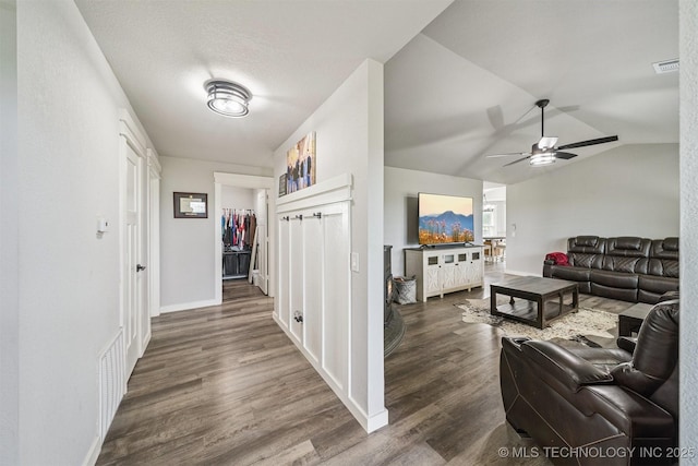 12929 N Sheridan Rd, Collinsville, OK 74021 - living room featuring dark wood-style flooring, ceiling fan, and vaulted ceiling