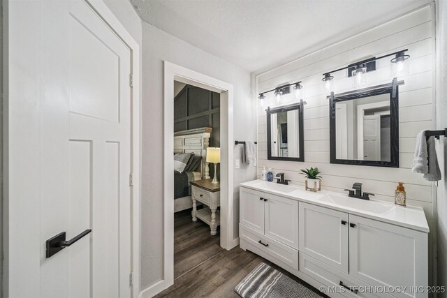 12929 N Sheridan Rd, Collinsville, OK 74021 - full bath with double vanity and wood finished floors
