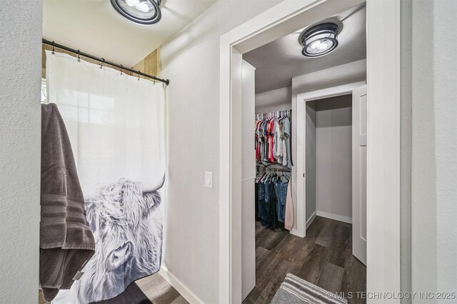 12929 N Sheridan Rd, Collinsville, OK 74021 - full bath with wood finished floors, a walk in closet, and curtained shower