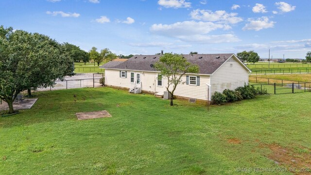 12929 N Sheridan Rd, Collinsville, OK 74021 - rear view of house with a fenced backyard, entry steps, and a shingled roof
