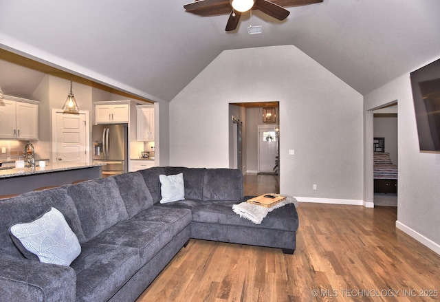 10423 S 233rd E Pl, Broken Arrow, OK 74014 - living room featuring a ceiling fan, dark wood finished floors, and vaulted ceiling
