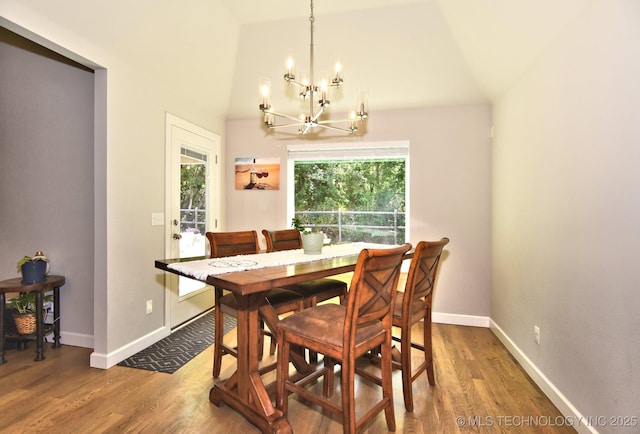 10423 S 233rd E Pl, Broken Arrow, OK 74014 - dining space featuring a chandelier, wood finished floors, and high vaulted ceiling