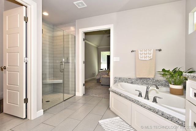 10423 S 233rd E Pl, Broken Arrow, OK 74014 - ensuite bathroom with a stall shower, tile patterned flooring, a garden tub, and recessed lighting