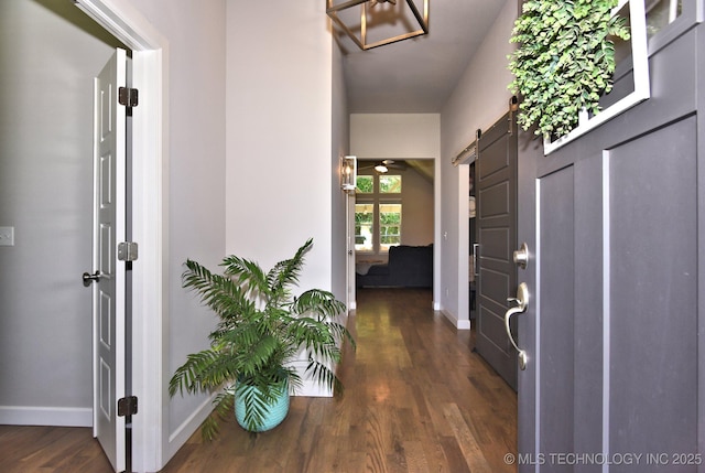 10423 S 233rd E Pl, Broken Arrow, OK 74014 - foyer with dark wood-style flooring and a barn door