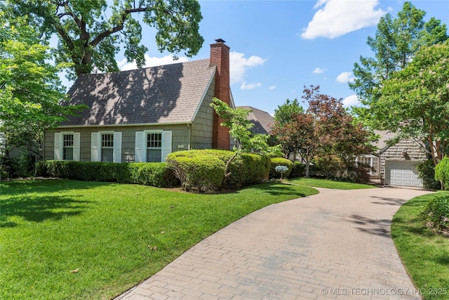321 E 29th Pl, Tulsa, OK 74114 - view of property exterior featuring driveway, a yard, roof with shingles, and a chimney