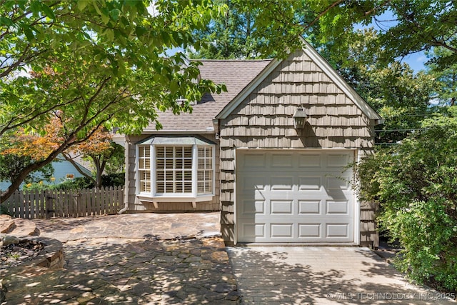 321 E 29th Pl, Tulsa, OK 74114 - view of front facade with driveway, roof with shingles, and an attached garage