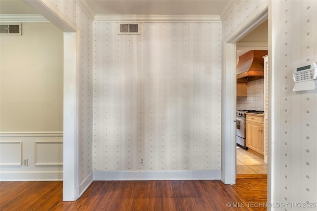321 E 29th Pl, Tulsa, OK 74114 - detailed view of high end range, wood finished floors, custom range hood, decorative backsplash, and crown molding