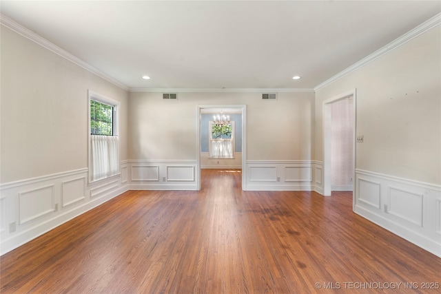 321 E 29th Pl, Tulsa, OK 74114 - unfurnished room featuring ornamental molding, recessed lighting, a wainscoted wall, a chandelier, and wood finished floors