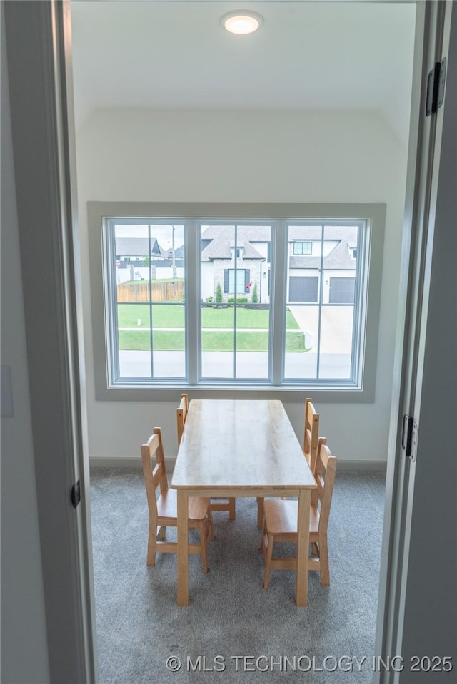 13661 S 23rd St, Bixby, OK 74008 - carpeted dining room featuring vaulted ceiling and baseboards