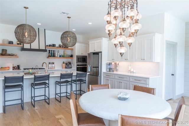 13661 S 23rd St, Bixby, OK 74008 - dining area with light wood-style flooring, recessed lighting, and a chandelier
