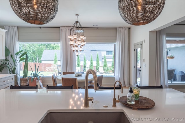 13661 S 23rd St, Bixby, OK 74008 - kitchen view of a chandelier, light countertops, and decorative light fixtures