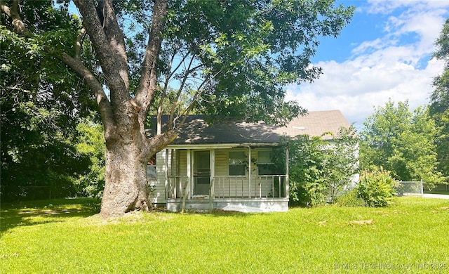 149 S 7th St, Porter, OK 74454 - view of front facade featuring a porch and a shingled roof