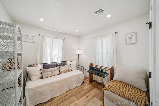 210 NW 4th St, Checotah, OK 74426 - living area featuring light wood-style floors and recessed lighting