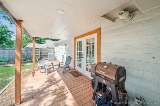 210 NW 4th St, Checotah, OK 74426 - wooden terrace featuring french doors and area for grilling