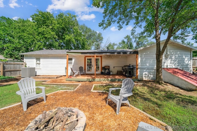 210 NW 4th St, Checotah, OK 74426 - back of house featuring french doors and a patio area