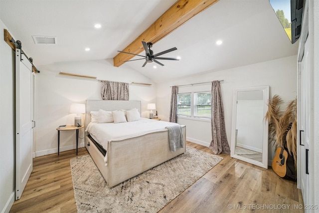 210 NW 4th St, Checotah, OK 74426 - bedroom with a barn door, light wood-type flooring, recessed lighting, and ceiling fan